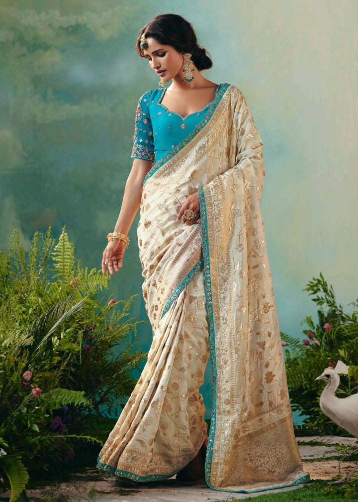 Off-White Pure Viscose Dola Silk Saree with Zari Weaving & Embroidered Blouse