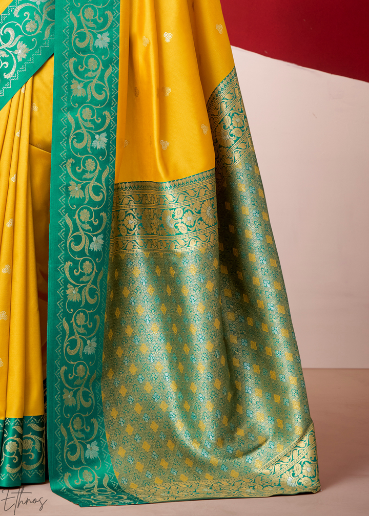 Saffron Yellow Paisley Border Satin Silk Saree