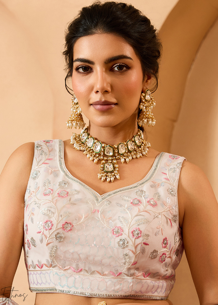 Cream Pink Pastel Floral Sequins Embroidered Net Lehenga Choli