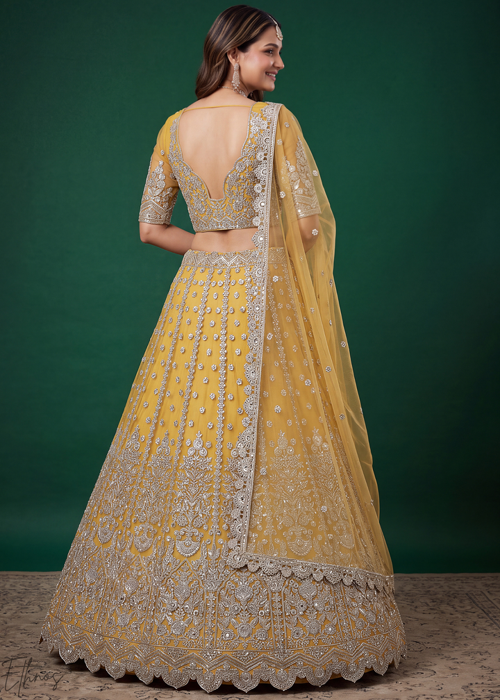 Mustard Yellow Heavy Floral Embroidered Net Lehenga
