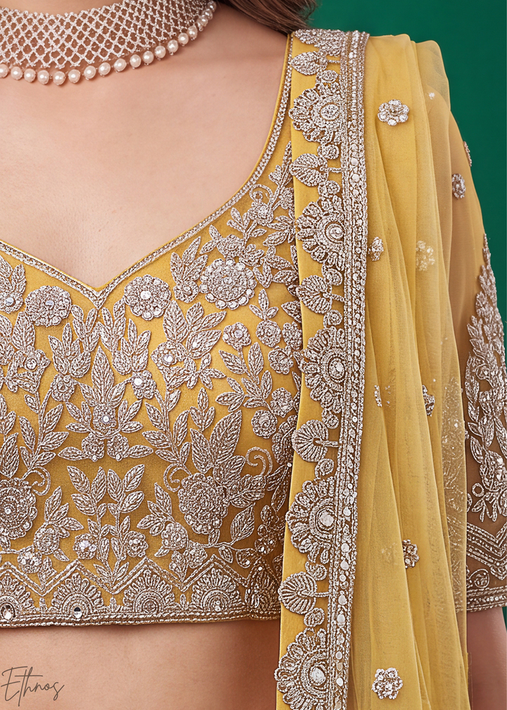 Mustard Yellow Heavy Floral Embroidered Net Lehenga