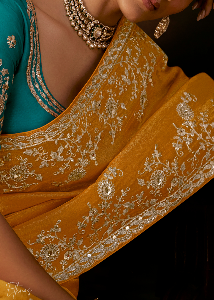 Sunset Amber Tambour Embroidered Border Tissue Saree