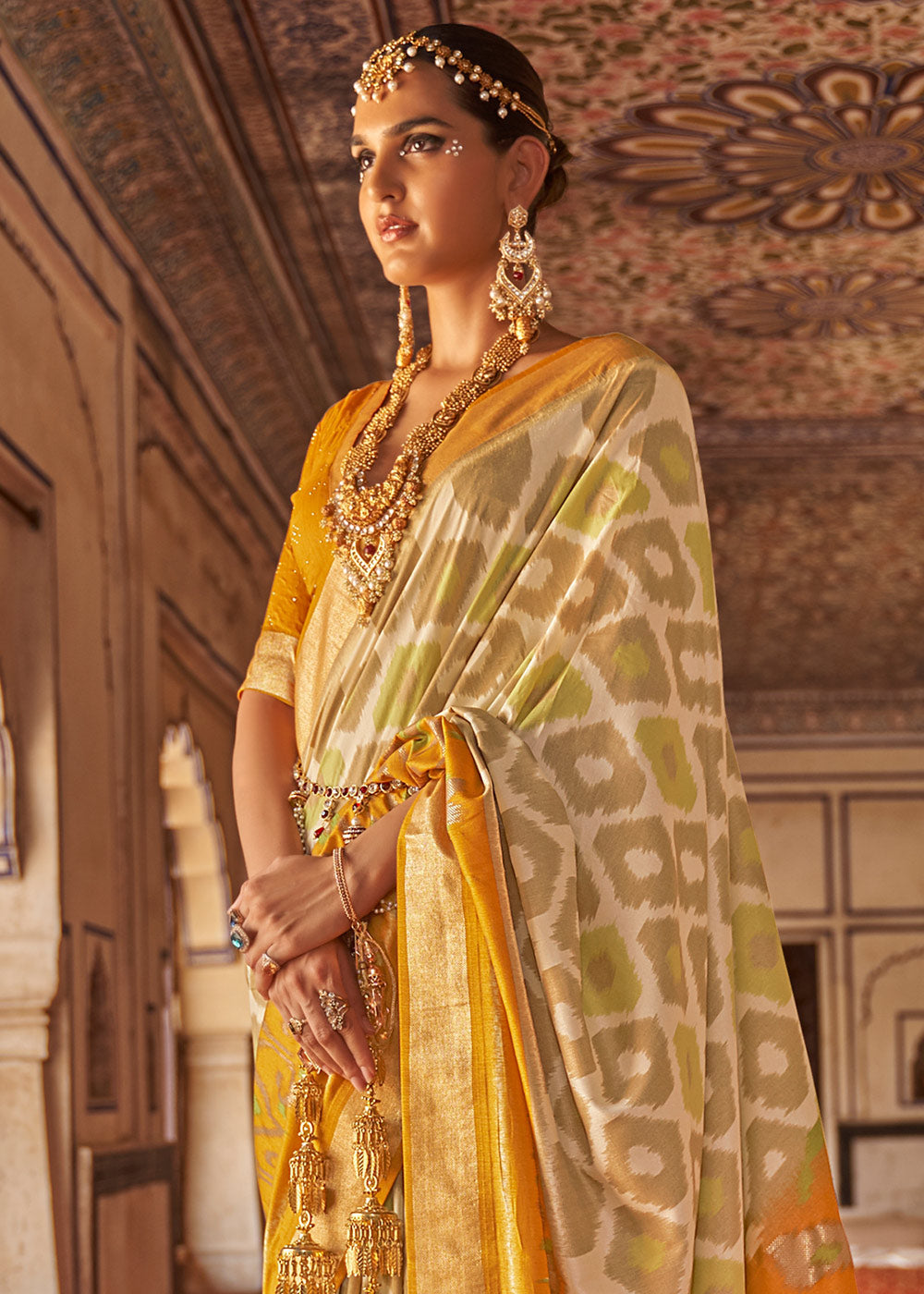 Cream & Yellow Printed Patola Dola Silk Saree with Zari Border