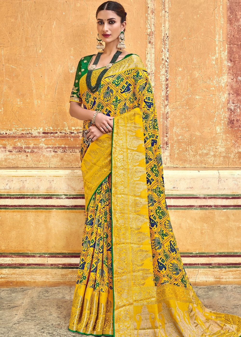 Yellow Patola Printed Silk Saree with Heavy Embroidery Border